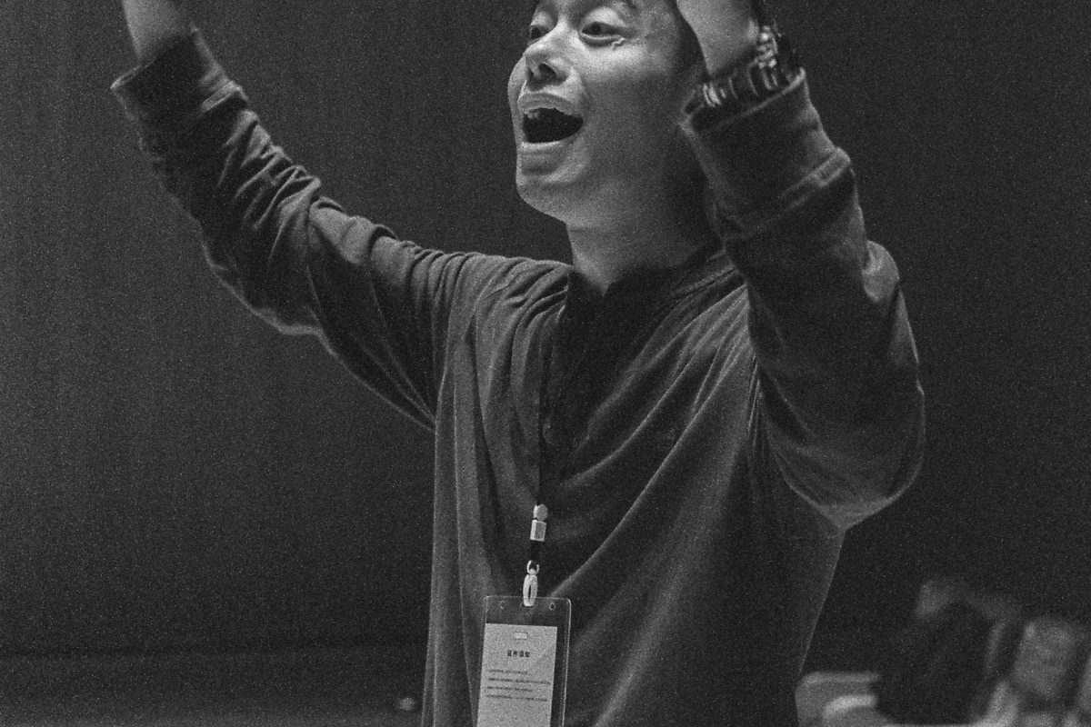 Musical conductor raising hands